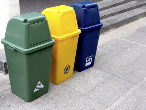 Enclosed and lockable skip positioned on a residential property in Holborn